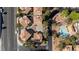 Aerial view of neighborhood featuring well-maintained landscaping, a community pool, and tree-lined streets at 3367 Cheltenham St, Las Vegas, NV 89129