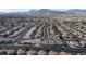 Expansive aerial shot of a residential area with rows of houses and scenic mountains in the background at 3367 Cheltenham St, Las Vegas, NV 89129