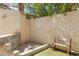 Low maintenance backyard with artificial turf, seating area, privacy walls, and desert landscaping at 3367 Cheltenham St, Las Vegas, NV 89129