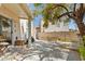 Landscaped backyard featuring mature tree, patio area, privacy walls, and space for outdoor activities at 3367 Cheltenham St, Las Vegas, NV 89129