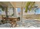 Covered patio with outdoor seating, mature tree, patio pavers, and adjacent building at 3367 Cheltenham St, Las Vegas, NV 89129