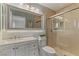 Modern bathroom featuring a glass enclosed shower, bright mirror, and updated sink with vanity at 3367 Cheltenham St, Las Vegas, NV 89129