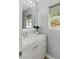 Clean, stylish bathroom with white vanity, modern fixtures, and natural light from the window at 3367 Cheltenham St, Las Vegas, NV 89129