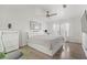Spacious bedroom featuring hardwood floors, a ceiling fan, and ample natural light at 3367 Cheltenham St, Las Vegas, NV 89129