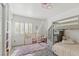 Charming bedroom with bunk beds, plush rug, and bright natural light from the window at 3367 Cheltenham St, Las Vegas, NV 89129