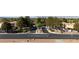 A welcoming entrance to a community with well-manicured landscaping and clear street signage at 3367 Cheltenham St, Las Vegas, NV 89129