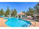 A sparkling pool features a charming pool house and comfortable lounge chairs for residents to relax and enjoy at 3367 Cheltenham St, Las Vegas, NV 89129