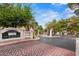 Community gated entrance with directory and stone pillars, offering security and neighborhood charm at 3367 Cheltenham St, Las Vegas, NV 89129