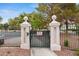 A secure gated entrance with stone pillars welcomes residents, providing privacy and peace of mind at 3367 Cheltenham St, Las Vegas, NV 89129