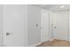 Bright hallway featuring light wood floors and white doors with modern hardware at 3367 Cheltenham St, Las Vegas, NV 89129