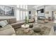 Inviting living room featuring large windows with shutters, fireplace and open concept to the dining area at 3367 Cheltenham St, Las Vegas, NV 89129