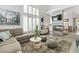 Comfortable living room with large windows and shutters, fireplace, and stylish furnishings, creating a cozy ambiance at 3367 Cheltenham St, Las Vegas, NV 89129