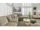 Inviting living room featuring large windows and neutral decor, creating a warm and welcoming atmosphere at 3367 Cheltenham St, Las Vegas, NV 89129