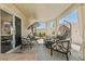 View of patio with multiple seating areas, shade covers, and decorative touches for relaxing and entertaining at 3367 Cheltenham St, Las Vegas, NV 89129