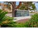 Community entrance sign for American West Village with lush landscaping in a residential neighborhood at 3367 Cheltenham St, Las Vegas, NV 89129