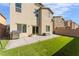 Spacious backyard with artificial turf, a patio, and a stainless-steel grill at 3815 Corellia Ave, North Las Vegas, NV 89084