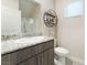 Bathroom features a sleek vanity with granite counters and stylish decor accents at 3815 Corellia Ave, North Las Vegas, NV 89084