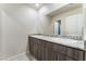 Bathroom with a double sink vanity and a gray granite countertop at 3815 Corellia Ave, North Las Vegas, NV 89084