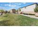 Scenic view of a community park featuring green grass, trees, and walking path at 3815 Corellia Ave, North Las Vegas, NV 89084