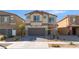 Charming two-story home featuring neutral stucco, a paved driveway, and a well-maintained xeriscaped front yard at 3815 Corellia Ave, North Las Vegas, NV 89084