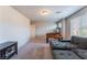 Spacious game room features carpet flooring, natural light and a comfortable sitting area at 3815 Corellia Ave, North Las Vegas, NV 89084