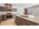 Spacious kitchen featuring a large island with granite countertops and stainless steel appliances at 3815 Corellia Ave, North Las Vegas, NV 89084