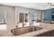 Modern kitchen features granite countertops and stainless steel sink, with an open concept to the living area at 3815 Corellia Ave, North Las Vegas, NV 89084