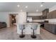 Kitchen featuring a large island with bar seating, stainless steel appliances, and modern cabinetry at 3815 Corellia Ave, North Las Vegas, NV 89084