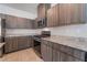 Stylish kitchen with granite countertops, stainless steel appliances, and wood-look cabinetry at 3815 Corellia Ave, North Las Vegas, NV 89084