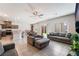 Open-concept living room with view of the kitchen, dining area, and sliding glass door to the backyard at 3815 Corellia Ave, North Las Vegas, NV 89084