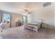 Spacious main bedroom offers lots of natural light, ceiling fan and comfortable carpet flooring at 3815 Corellia Ave, North Las Vegas, NV 89084