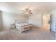 Spacious main bedroom offers lots of natural light, ceiling fan and comfortable carpet flooring at 3815 Corellia Ave, North Las Vegas, NV 89084