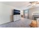 Spacious main bedroom offers lots of natural light, ceiling fan and comfortable carpet flooring at 3815 Corellia Ave, North Las Vegas, NV 89084