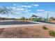 Community playground featuring modern play structures, shaded areas, and accessible walkways under a partly cloudy blue sky at 3815 Corellia Ave, North Las Vegas, NV 89084
