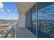 Balcony with panoramic city views, complemented by sleek glass railing and sliding glass doors at 4381 W Flamingo Rd # 3120, Las Vegas, NV 89103