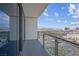 Balcony with panoramic city views, complemented by a sleek glass railing and sliding glass doors at 4381 W Flamingo Rd # 3120, Las Vegas, NV 89103