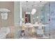 Modern bathroom with marble tile, vessel sink, glass shower enclosure, and sleek fixtures at 4381 W Flamingo Rd # 3120, Las Vegas, NV 89103