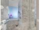 Elegant bathroom featuring stylish marble tile, glass shower enclosure, a tub, and contemporary fixtures at 4381 W Flamingo Rd # 3120, Las Vegas, NV 89103