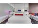 Bright bedroom with modern furnishings, mirrored headboard, and a pop of color from decorative pillows and lighting at 4381 W Flamingo Rd # 3120, Las Vegas, NV 89103