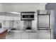 Close-up of the stainless steel kitchen featuring modern appliances and ample counter space at 4381 W Flamingo Rd # 3120, Las Vegas, NV 89103