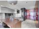 Stylish kitchen boasts stainless steel appliances and countertops, a modern light fixture, and sleek cabinetry at 4381 W Flamingo Rd # 3120, Las Vegas, NV 89103