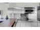 Modern kitchen featuring stainless steel countertops, a built-in microwave, and sleek cabinetry at 4381 W Flamingo Rd # 3120, Las Vegas, NV 89103