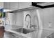Close-up of the stainless steel kitchen sink and faucet with modern fixtures and ample counter space at 4381 W Flamingo Rd # 3120, Las Vegas, NV 89103