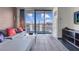 Living room with comfortable seating, a balcony and city views at 4381 W Flamingo Rd # 3120, Las Vegas, NV 89103