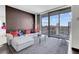 Cozy living room boasts city views from the large balcony, modern sofa, and stylish decor at 4381 W Flamingo Rd # 3120, Las Vegas, NV 89103