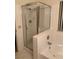 Bathroom displaying a shower with a glass door and a white soaking tub at 4382 Valley Regal Way, North Las Vegas, NV 89032