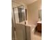 Bathroom showcasing a glass-enclosed shower, separate soaking tub, and a bright window at 4382 Valley Regal Way, North Las Vegas, NV 89032