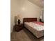 Bedroom featuring a bed with a patterned comforter and matching end tables at 4382 Valley Regal Way, North Las Vegas, NV 89032