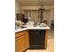 Kitchen featuring laminate countertops, a stainless steel sink, and vertical blinds at 4382 Valley Regal Way, North Las Vegas, NV 89032