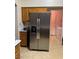 Kitchen featuring stainless steel refrigerator and light wood cabinets at 4382 Valley Regal Way, North Las Vegas, NV 89032